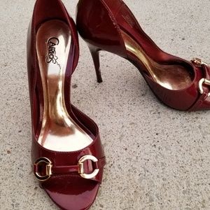 Carlos Satana patent pumps with gold detailing